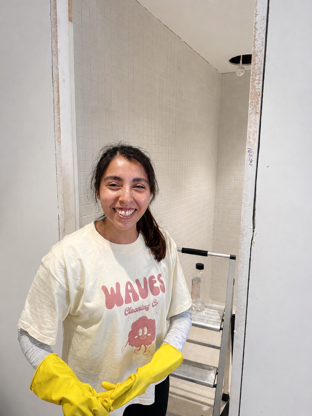 Waves team member cleaning glazing